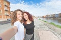 Two girls taking a selfie in the city Royalty Free Stock Photo