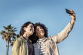 Two girls taking selfie with a mobile phone Royalty Free Stock Photo