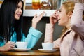 Two girls talking in cafe Royalty Free Stock Photo