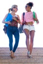 Two girls talking and laughing in the stairs. Royalty Free Stock Photo