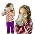 Two girls talking on a tin phone Royalty Free Stock Photo