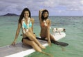 Two girls on their paddle board Royalty Free Stock Photo