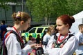 Two girls in traditional polish costume chatting