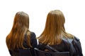 Two girls twins in auditory during presentation or seminar. Isolated background. Teenagers or young women at university lecture or