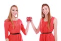 Two girls twins in red dresses with gift