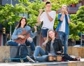 Two girls and two boys with musical instruments Royalty Free Stock Photo