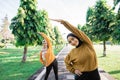 two girls in veil do arm stretches by raising their arms upward with their bodies leaning to the side Royalty Free Stock Photo