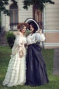 Two girls in vintage clothes and hats Royalty Free Stock Photo