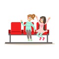 Two Girls Waiting Taking Seats In Cinema Room, Part Of Happy People In Movie Theatre Series