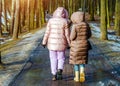Two girls walk along the path
