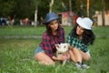 Two girls walking with his dog. cowboy hat and Royalty Free Stock Photo