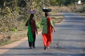 Two girls walking on the street.