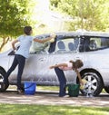 Two Girls Washing Car Together Royalty Free Stock Photo