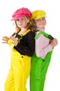 Two girls wearing colorfull dungarees