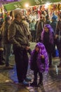 Two girls wearing purple wigs