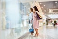 Two Girls Window Shopping in Mall Royalty Free Stock Photo