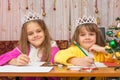 Two girls write wishes for new year Royalty Free Stock Photo