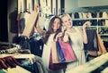Two glad girls having many shopping bags Royalty Free Stock Photo