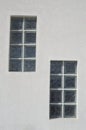 Two glass block windows looking outside on wall Royalty Free Stock Photo