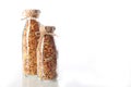 Two glass bottles of granola or granola on a white background. An isolated object. Copy of the space. Horizontal photo Royalty Free Stock Photo