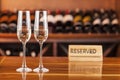 Two glass with champagne in background with bottles of wine Royalty Free Stock Photo