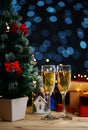 Two Glass Of Champagne Beside Christmas Tree