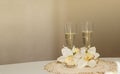 Two glass of champagne decorated with flowers Royalty Free Stock Photo