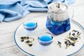 Two glass cup of blue Anchan tea with teapot