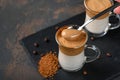 Two glass cups with Dalgona frothy coffee trend korean drink latte espresso with coffee foam Royalty Free Stock Photo