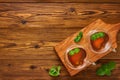 Two glass cups of herbal mint tea on a wooden board. Top view with copy space Royalty Free Stock Photo