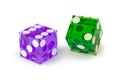 Two glass dice of different colors, blue and green, isolated on white, with a light shadow. Royalty Free Stock Photo