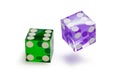 Two glass dice of different colors, green and blue, isolated on white, with a light shadow. Royalty Free Stock Photo