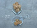 Two glass goblets with wine corks