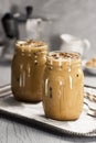 Two Glass Jars of Iced Coffee with Cream