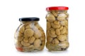 Two glass jars with marinated champignons