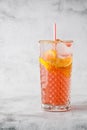 Two glass with lemonade and orange cocktail with lemon and orange, cold refreshing drink or beverage with ice on bright marble Royalty Free Stock Photo