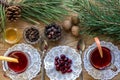 Two glass of mulled wine with cinnamon sticks, slice of oranges and apple, star anise on a wooden table Royalty Free Stock Photo