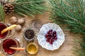 Two glass of mulled wine with cinnamon sticks, slice of oranges and apple, star anise on a wooden table Royalty Free Stock Photo