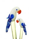 Two glass parrot swizzle sticks Royalty Free Stock Photo