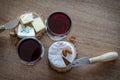 Two glass of red wine with few pieces of cheese at wooden background. top view Royalty Free Stock Photo