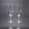 Two glass tall glasses for wine on a black background. Royalty Free Stock Photo