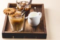 Two Glass of Tasty Cold Coffee on Wooden Tray Black Coffee and Coffee with Milk Refreshing Cold Summer Drink Horizontal Bowl with Royalty Free Stock Photo