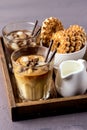 Two Glass of Tasty Cold Coffee on Wooden Tray Black Coffee and Coffee with Milk Refreshing Cold Summer Drink Vertical Bowl with