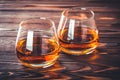 Two glass of whiskey, cognac, brandy on a dark brown wooden table. Bourbon. Strong alcohol drink close-up. Rum, scotch. Still life Royalty Free Stock Photo