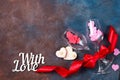 Two glass of wine, hearts and gift box on stone background. Romantic still life. Valentine`s Day with copy space, flat Royalty Free Stock Photo