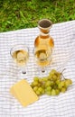 Two glass of wine, wine bottle, white grapes and cheese Royalty Free Stock Photo