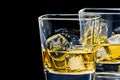 Two glasses of alcoholic drink on black background