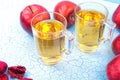 Two glasses of apple juice and red apples on wooden background Royalty Free Stock Photo