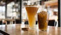 Two glasses of beer and a cookie on a table Royalty Free Stock Photo