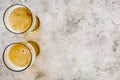 Two glasses of beer on grey stone background top view copyspace Royalty Free Stock Photo